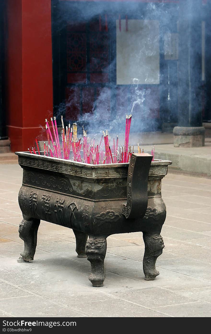 A box with burning incense in a temple in Chengdu, China. A box with burning incense in a temple in Chengdu, China.