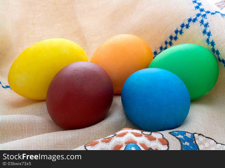 Easter  painted eggs on unbleached linen with embr