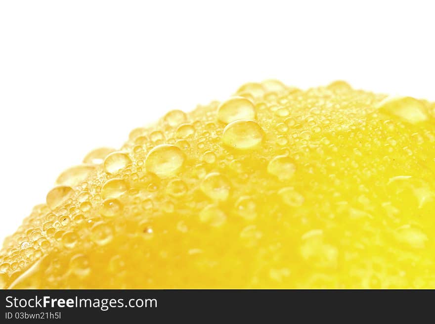 Yellow Lemon and dew closeup, isolated on a white background. Yellow Lemon and dew closeup, isolated on a white background.