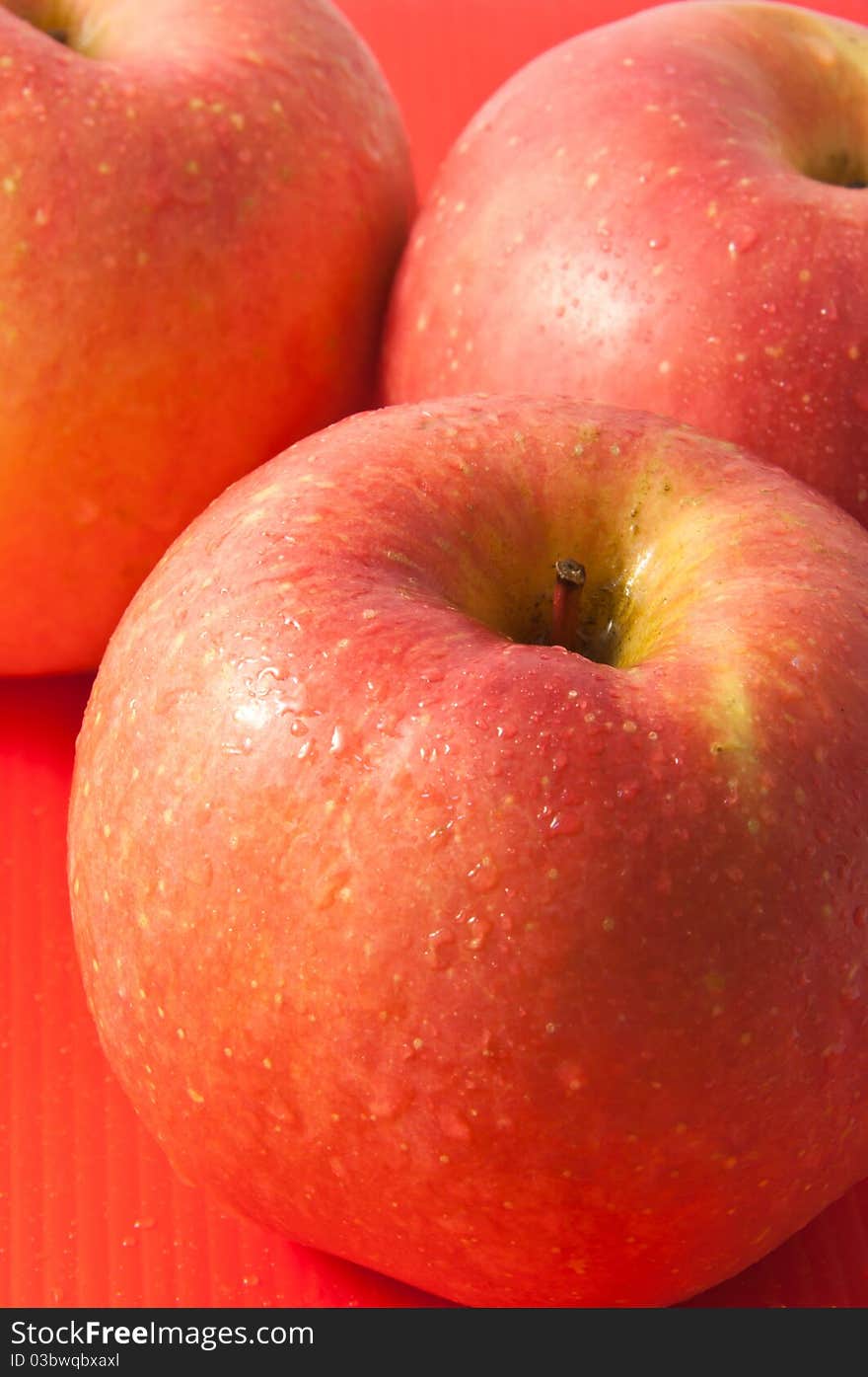 Red apple with water drop