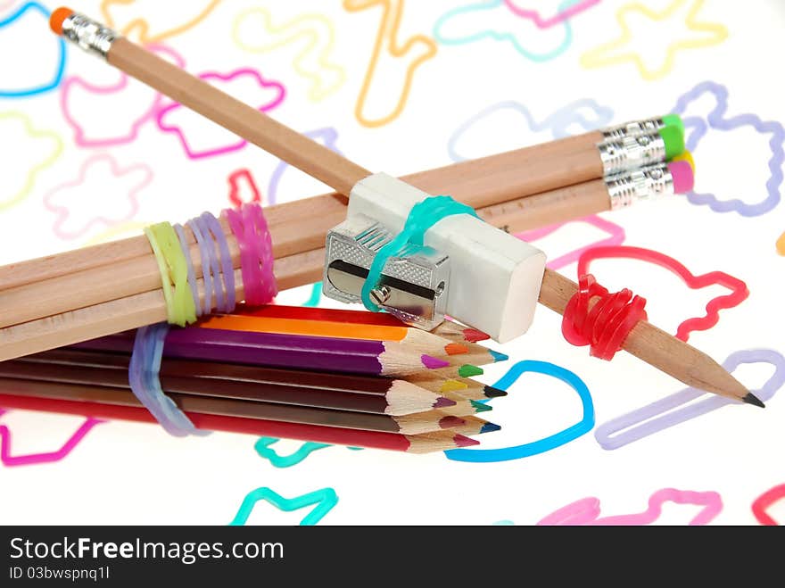 Close-up to colourful silly shaped rubber band bracelets; used for office and home related objects