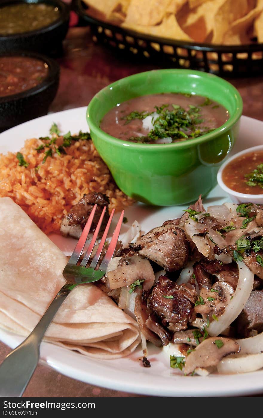 Tacos with re-fried beans and rice. Tacos with re-fried beans and rice