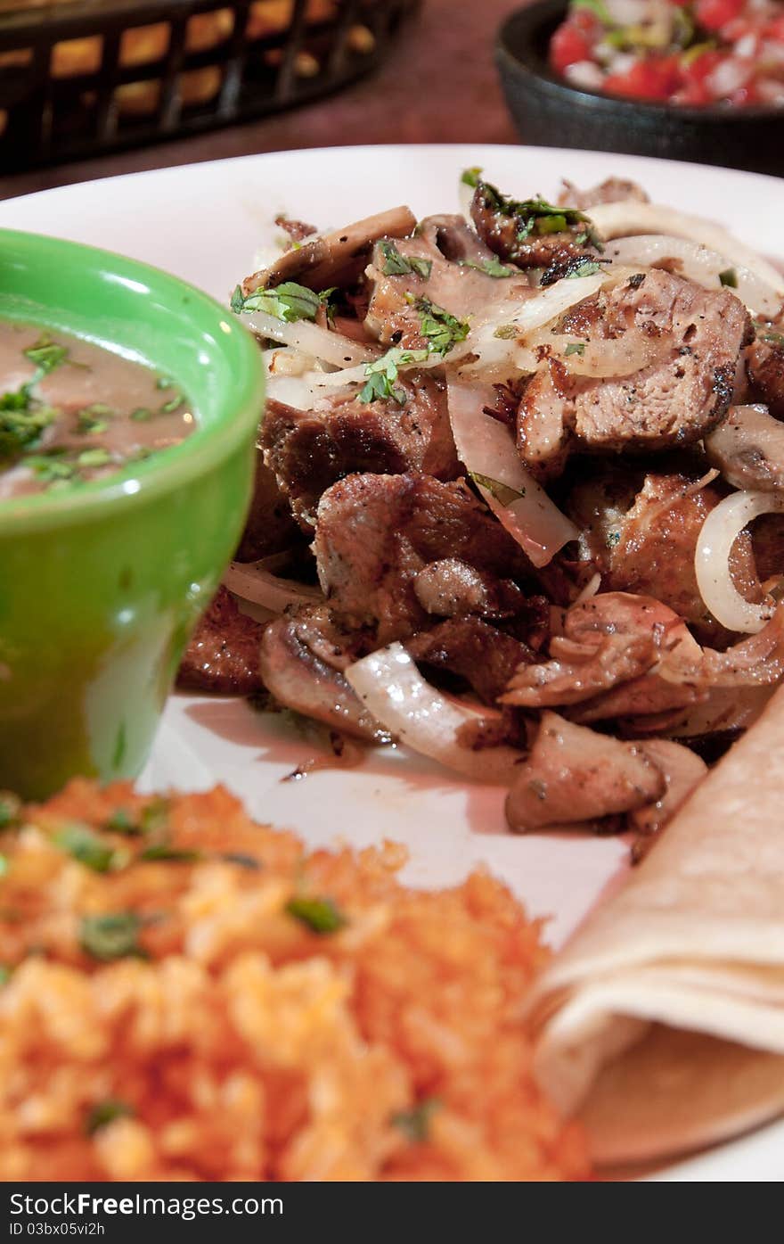 Tacos with re-fried beans and rice. Tacos with re-fried beans and rice