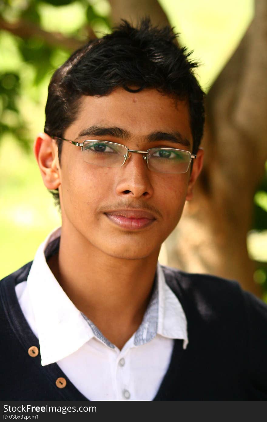 Young Indian Boy with Spiked hair and Specs