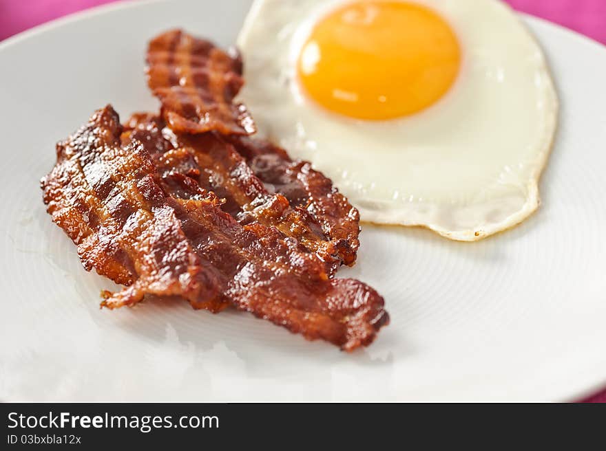 Closeup on bacon and egg