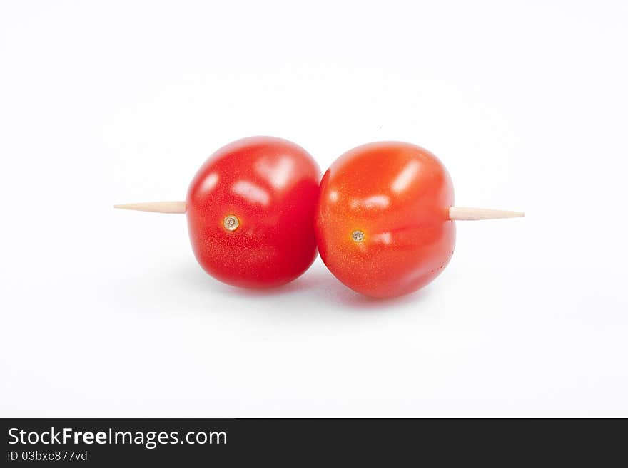 Cherry tomatoes with the toothpick. Cherry tomatoes with the toothpick