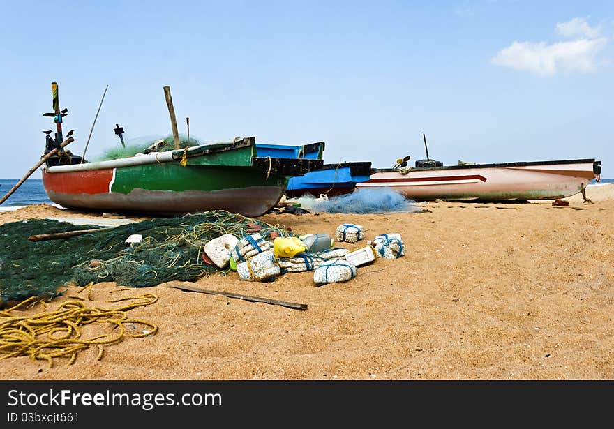 Fishing boats, nets, floats and tackle, blue skies, wispy clouds. Fishing boats, nets, floats and tackle, blue skies, wispy clouds