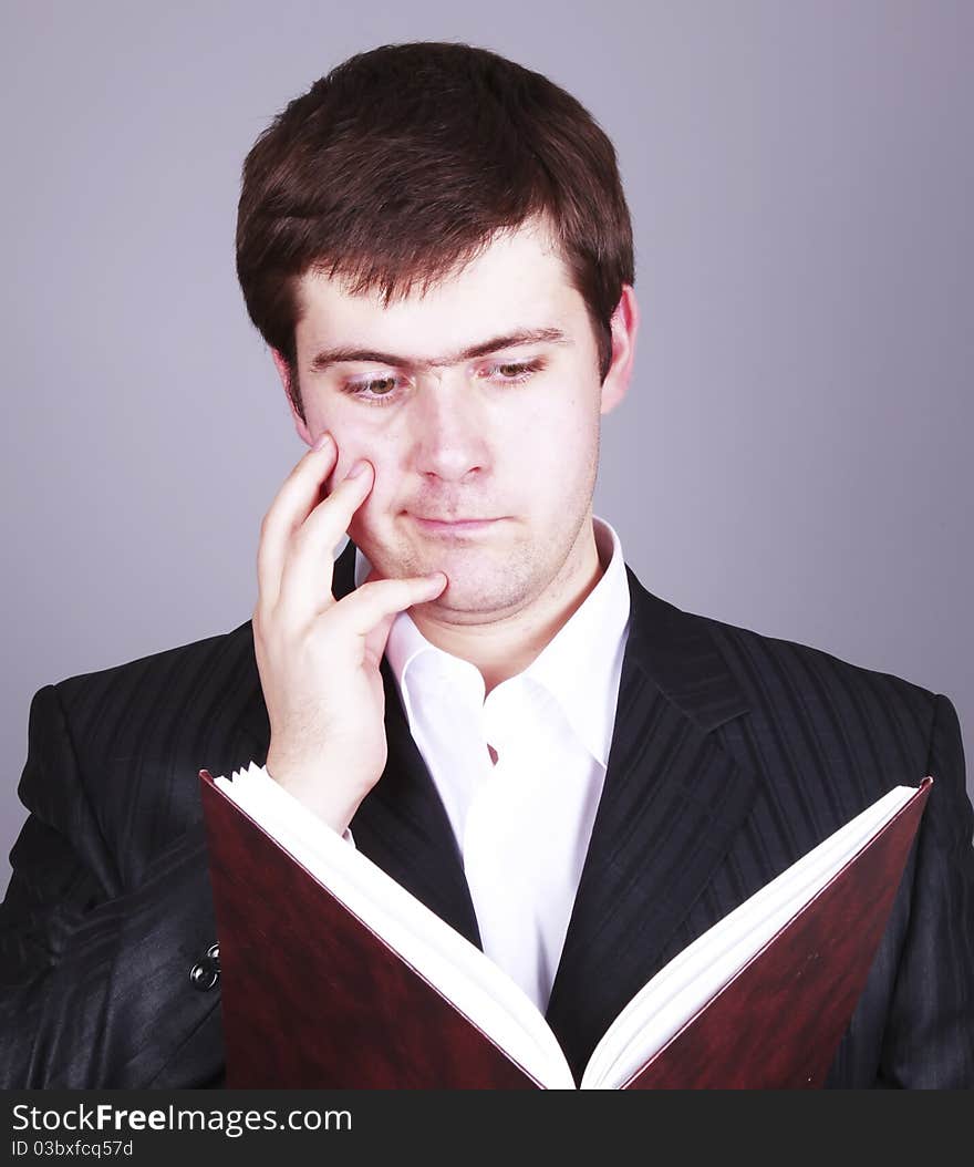 Surprise Businessman with book