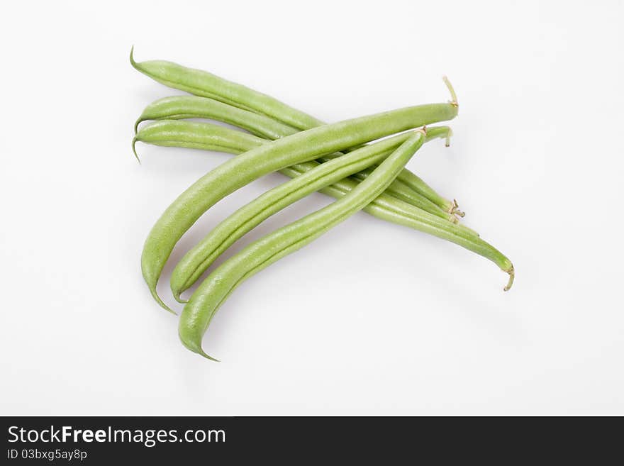 Green, french beans on white,  clipping path