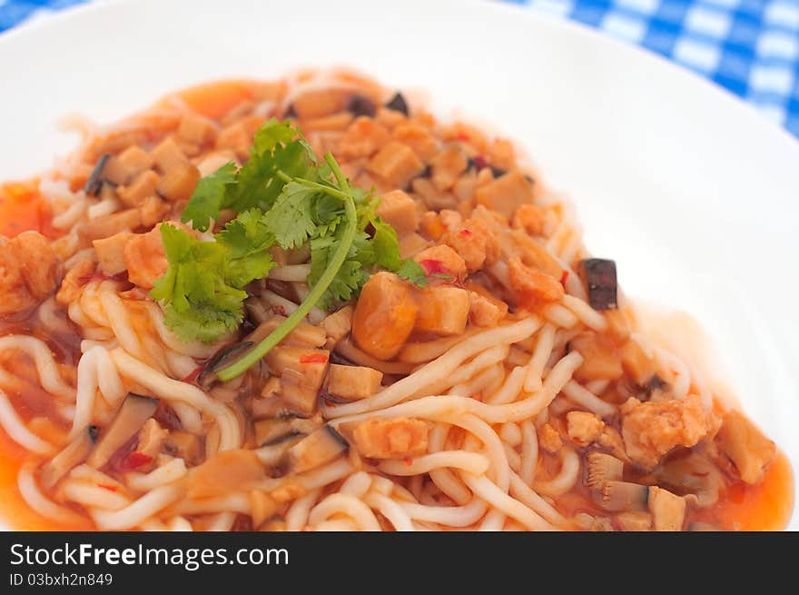 Spicy white noodle delicacy topped with nutritious vegetables. Spicy white noodle delicacy topped with nutritious vegetables.