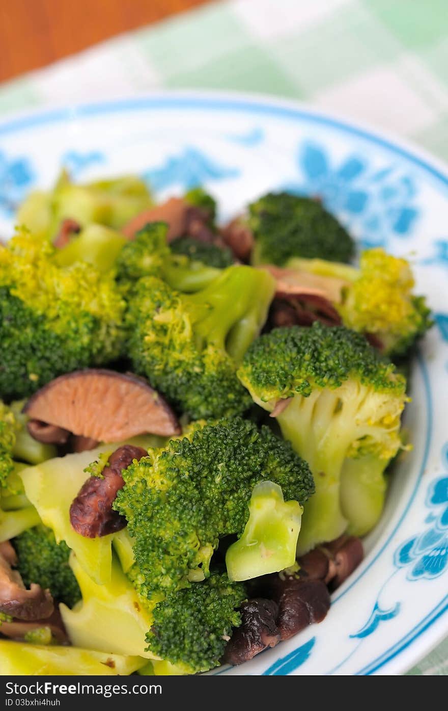 Chinese style healthy broccoli and black mushrooms for a healthy diet. Chinese style healthy broccoli and black mushrooms for a healthy diet.