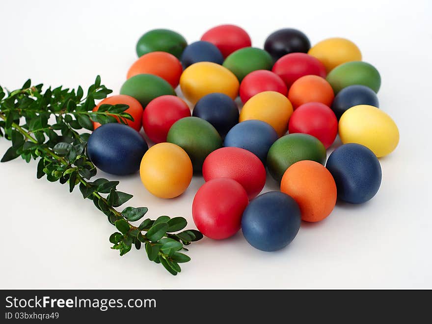 Painted Easter eggs with the twig of the box tree