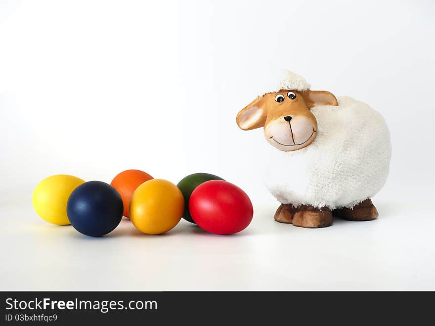 Easter painted eggs with the lamb on the white background. Easter painted eggs with the lamb on the white background