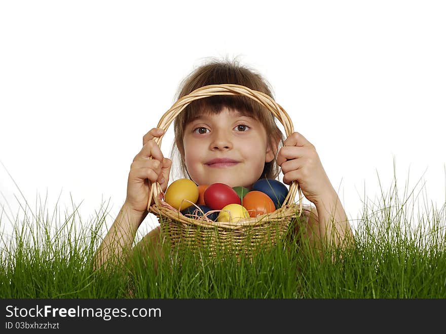 Girl keeping the basket with Easter painted eggs. Girl keeping the basket with Easter painted eggs