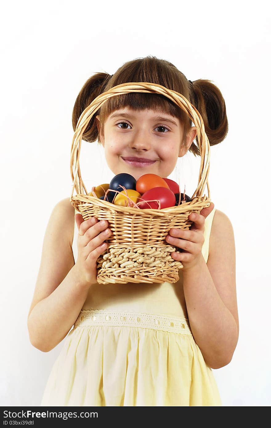 Girl keeping the basket with Easter painted eggs. Girl keeping the basket with Easter painted eggs