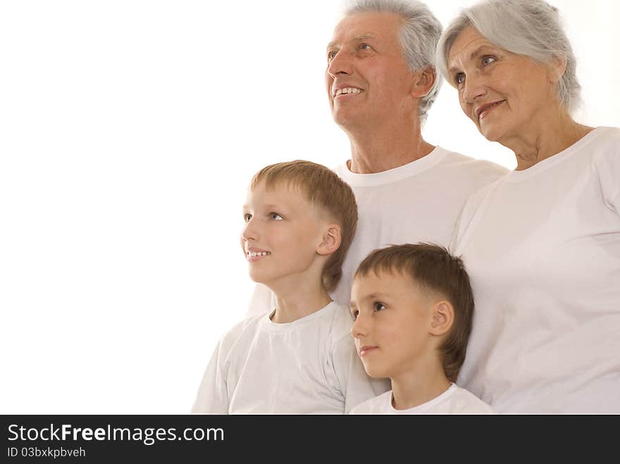 Family of four together on a white background