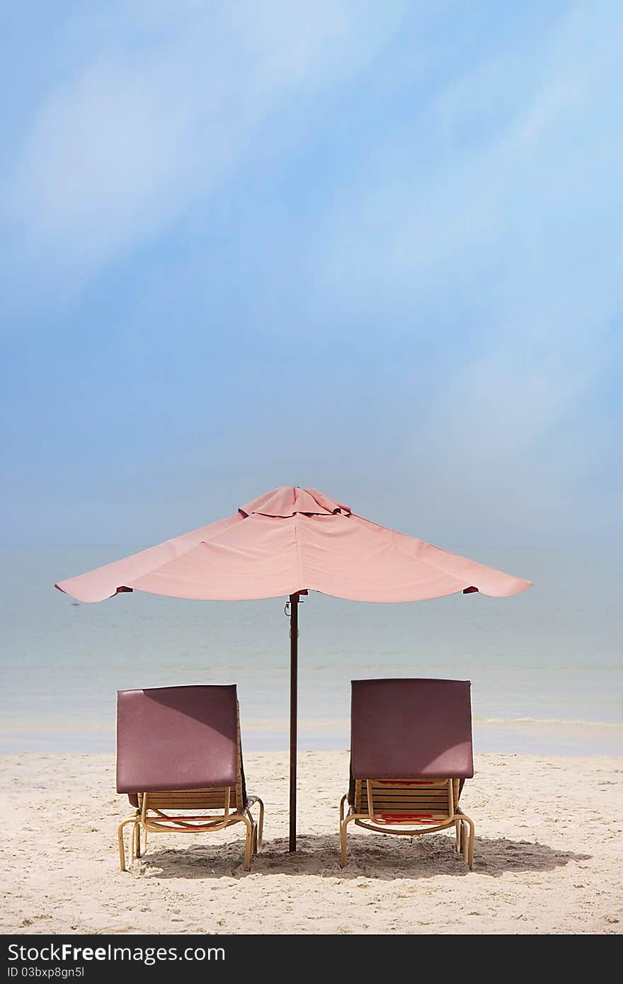 Chairs and umbrella on tropical beach. Chairs and umbrella on tropical beach