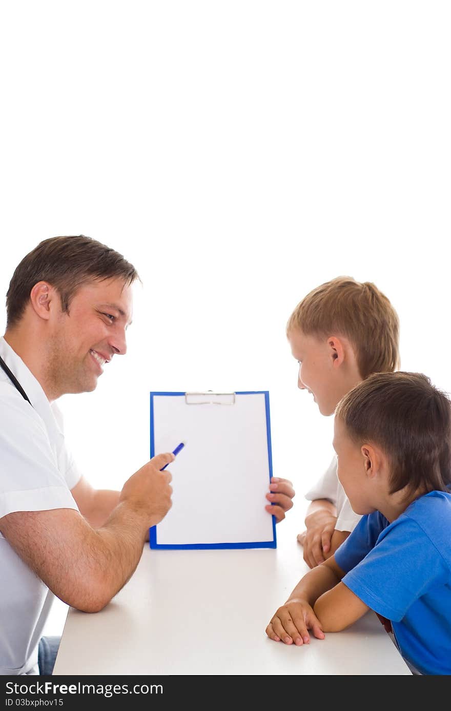 Pediatrition Talking With Two Patients