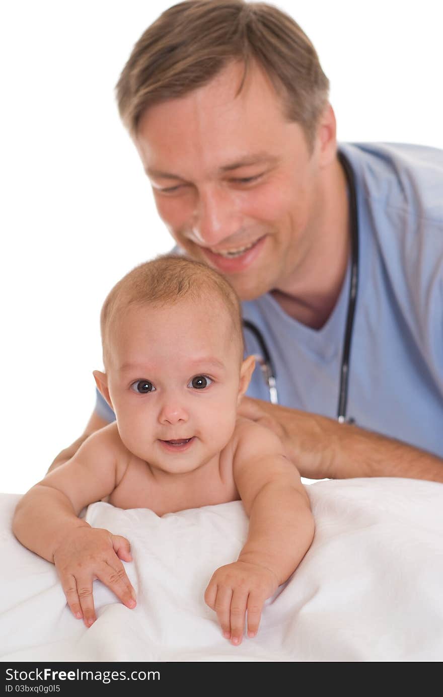 Doctor examining newborn on a white