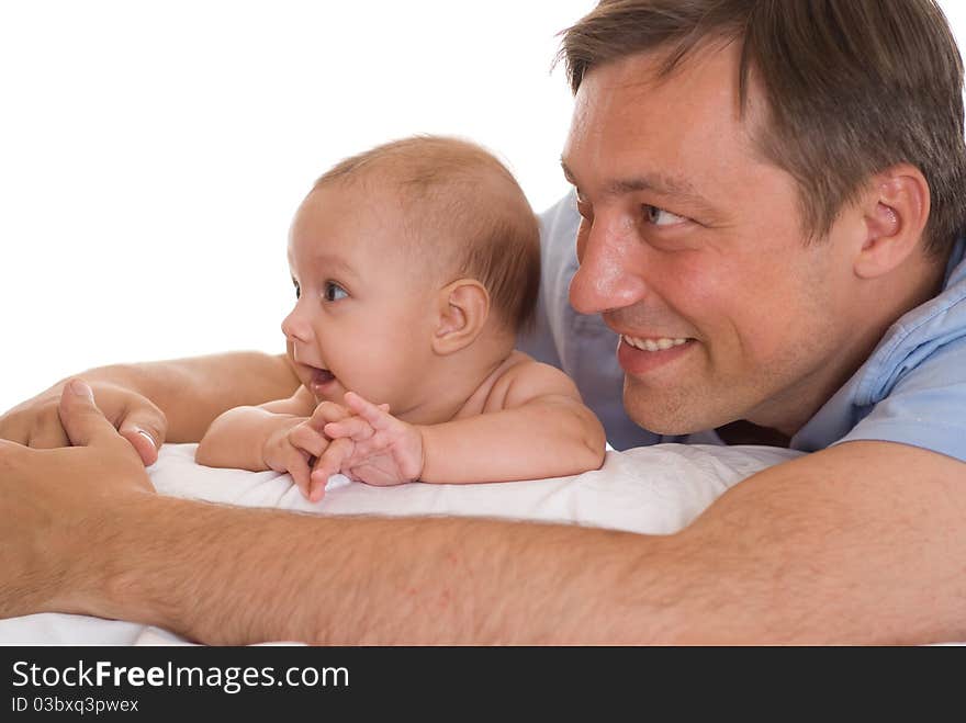 Father and his daughter sitting at the wite desk