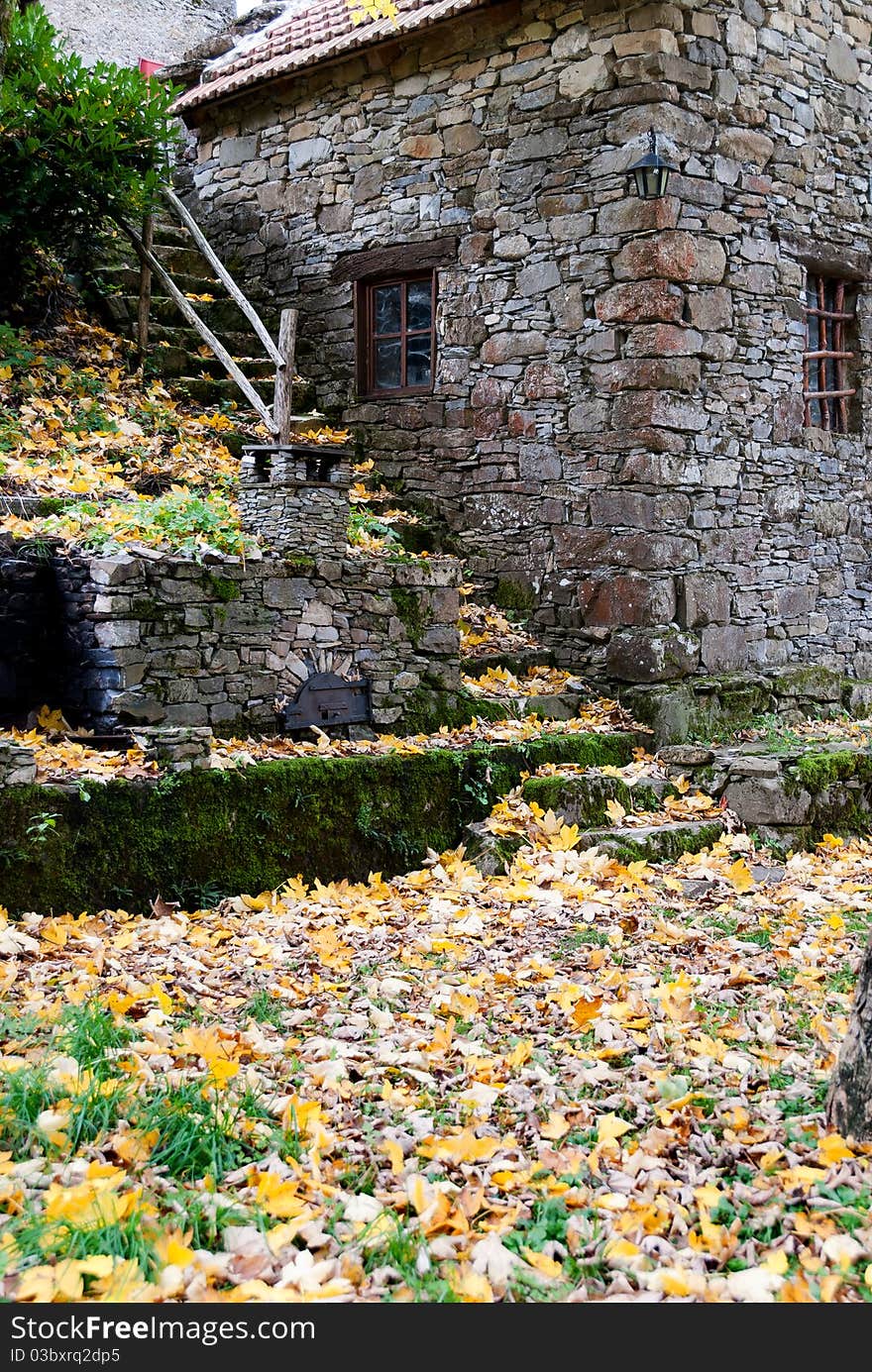 Autumn garden of a rustic stone