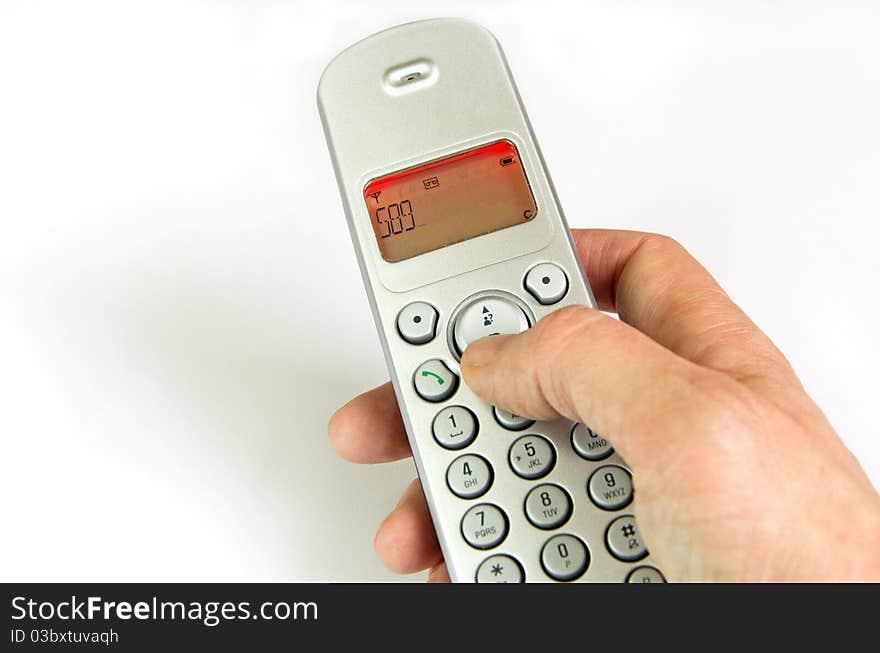 Hand dialing the phon in front of white background. Hand dialing the phon in front of white background