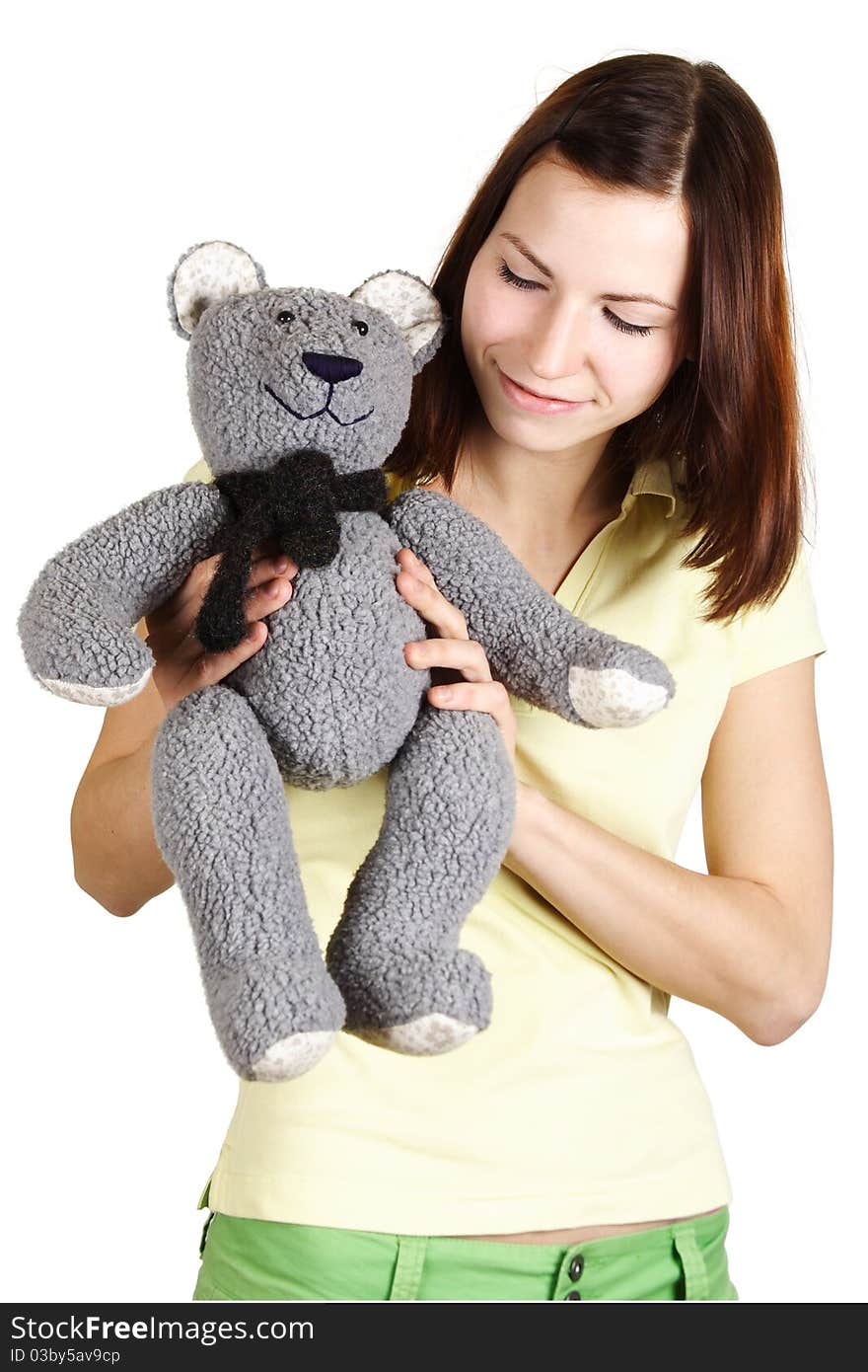 Girl holding soft bear toy