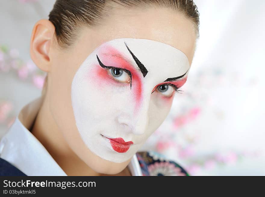 Japan geisha woman with creative make-up.close-up artistic portrait