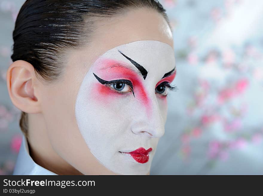 Japan geisha woman with creative make-up.close-up artistic portrait