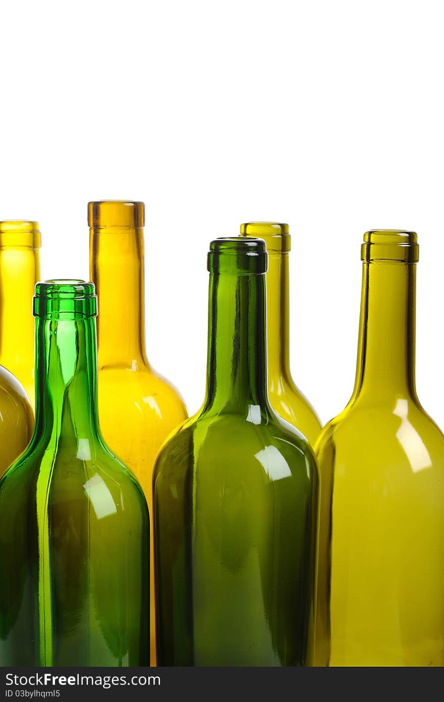 Many empty green wine bottles isolated on white background