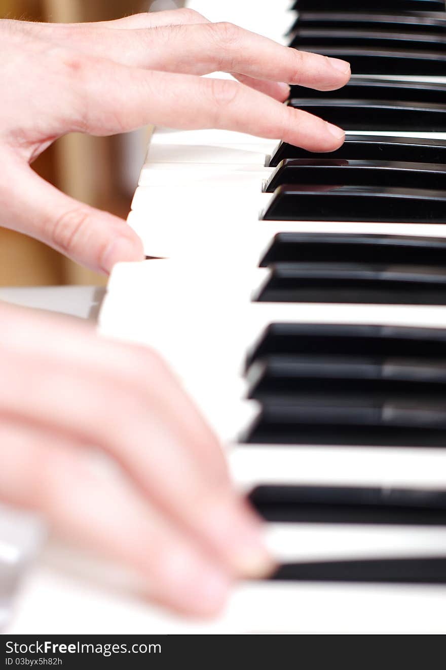 Men playing piano close up. Men playing piano close up