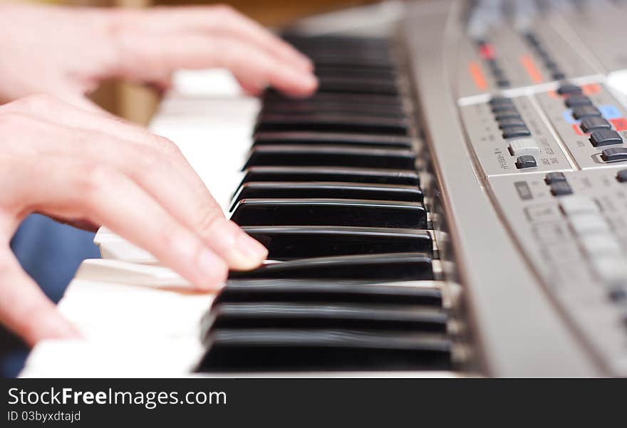 Men playing keyboard close up. Men playing keyboard close up