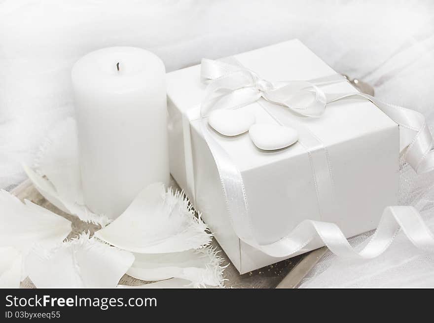 White gift box with candle and tulip