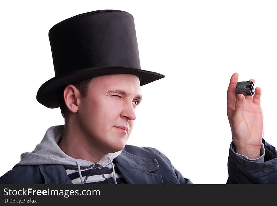 Portrait of the handsome man in a top-hat with a spare part in hand