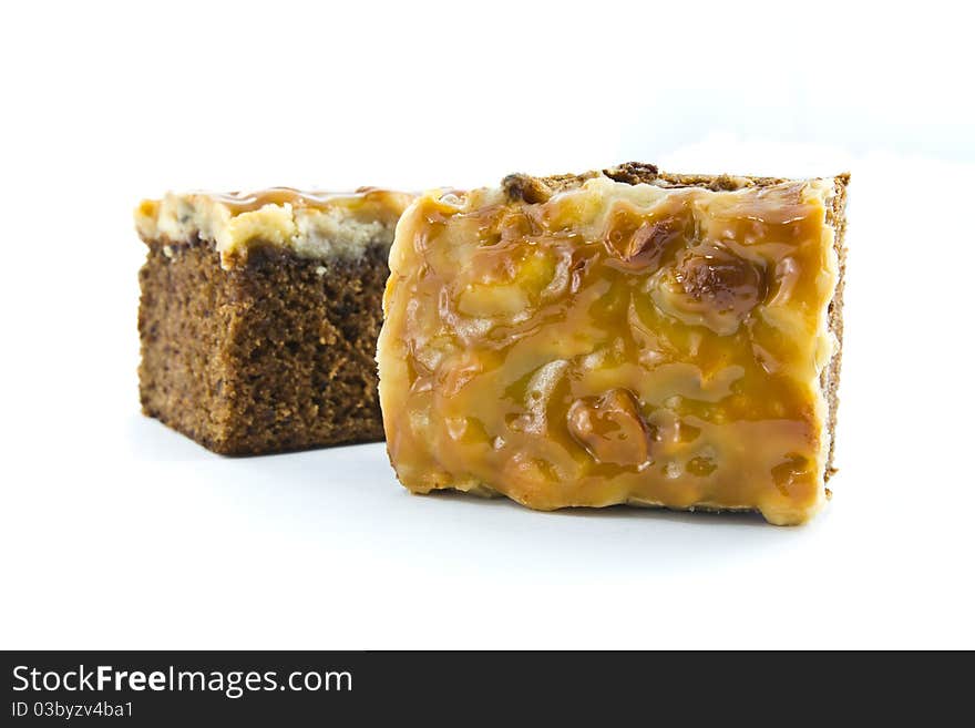 Piece of toffee cake isolated on white background