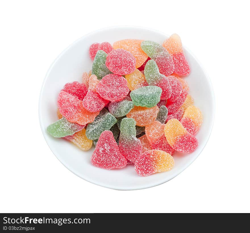 Sugar coated gumdrops in a bowl isolated on a white background