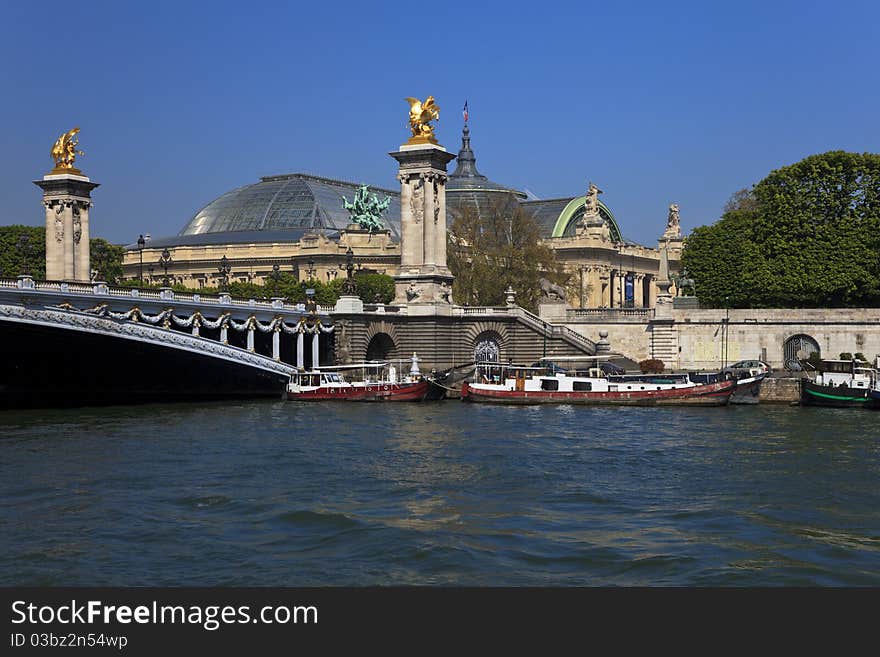 View of the Alexander III Bridge over the Seine River and Grand Palace, Paris, France. View of the Alexander III Bridge over the Seine River and Grand Palace, Paris, France.