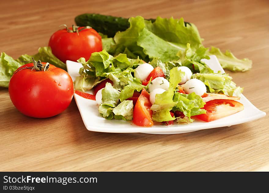 Salad with mozzarella and tomatoes