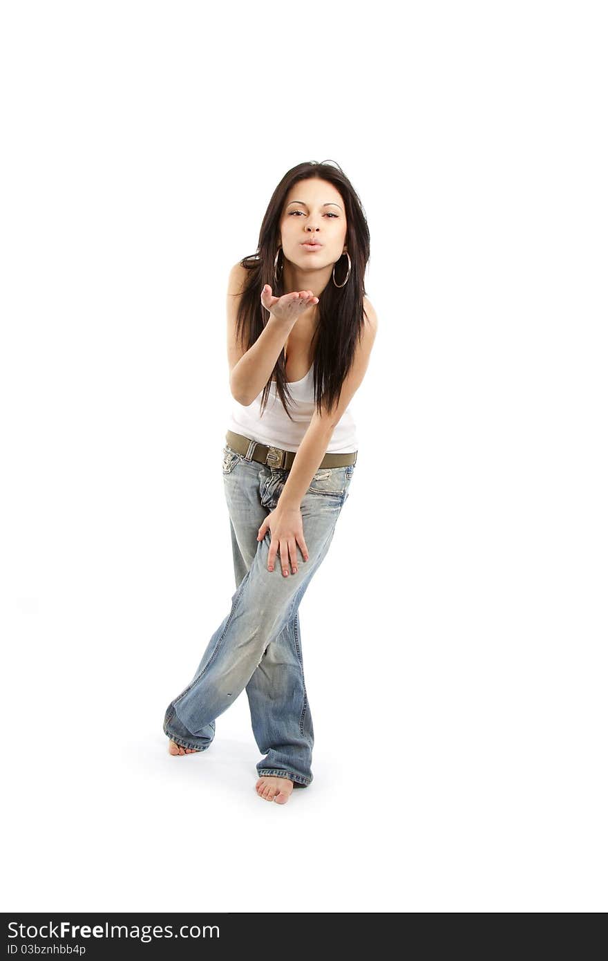 Young female blowing a kiss against white. Young female blowing a kiss against white