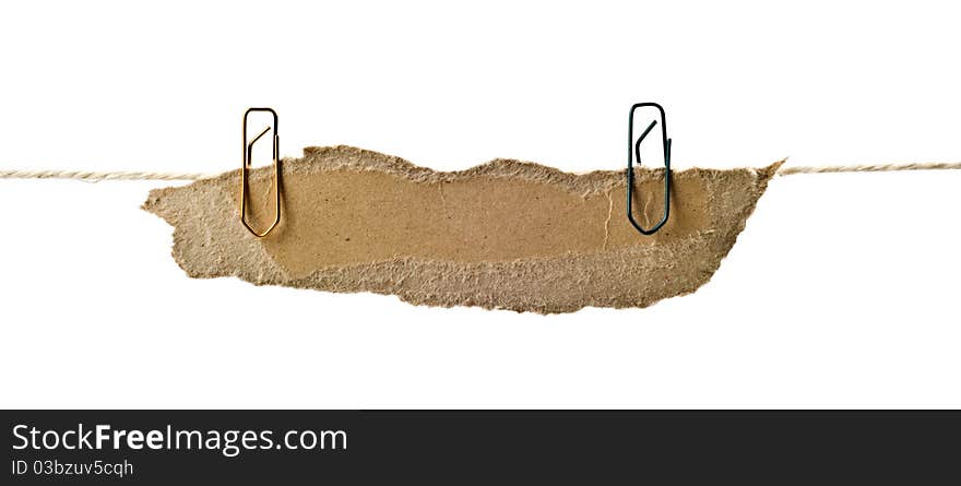 Close up of post it reminders and clothespins attached to a rope on white background. Close up of post it reminders and clothespins attached to a rope on white background