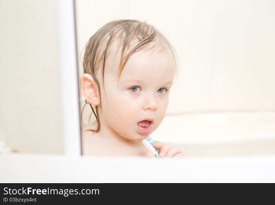 Adorable Baby Brushing Teeth In Shower