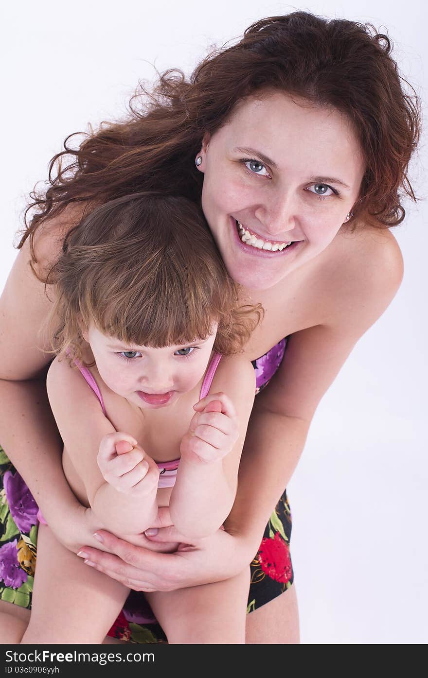 Little Girl Sits On Mother S Lap.