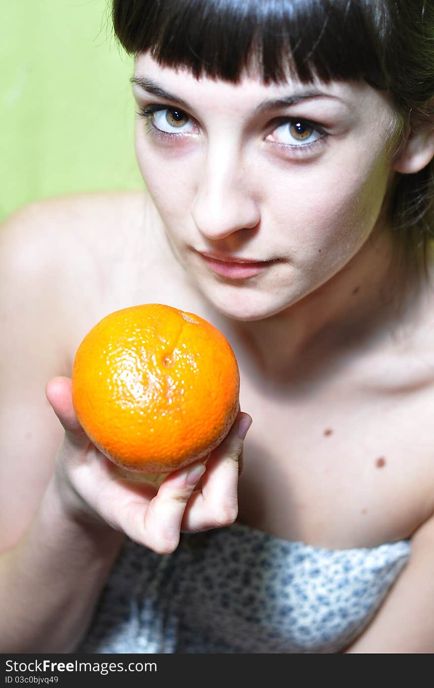 Picture of young girl holding an orange. Picture of young girl holding an orange