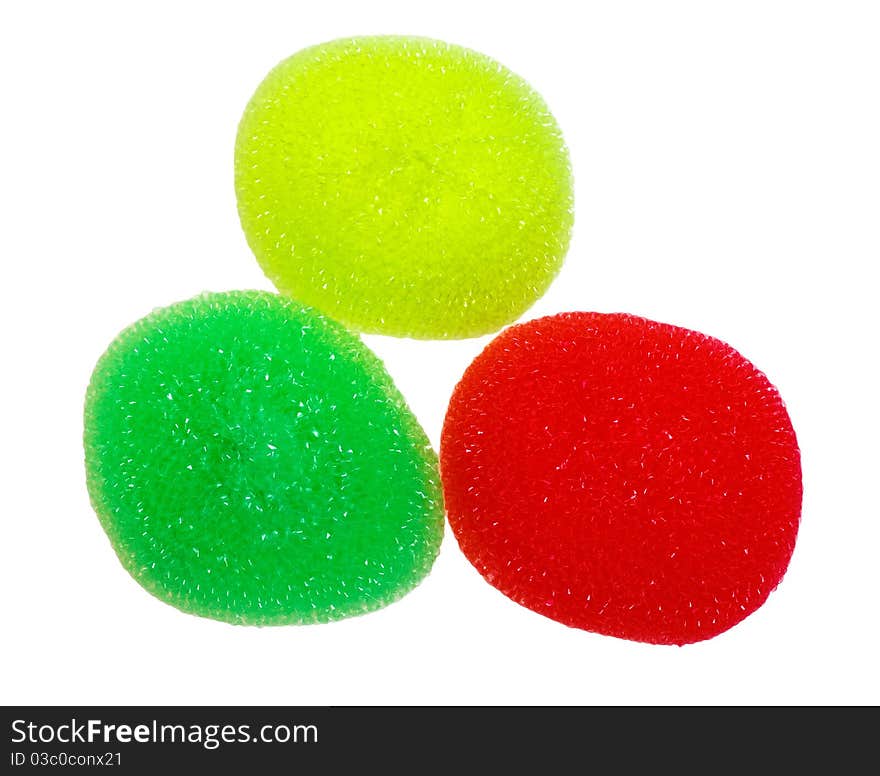 Multicolored sponges for washing dishes, isolated on a white background.