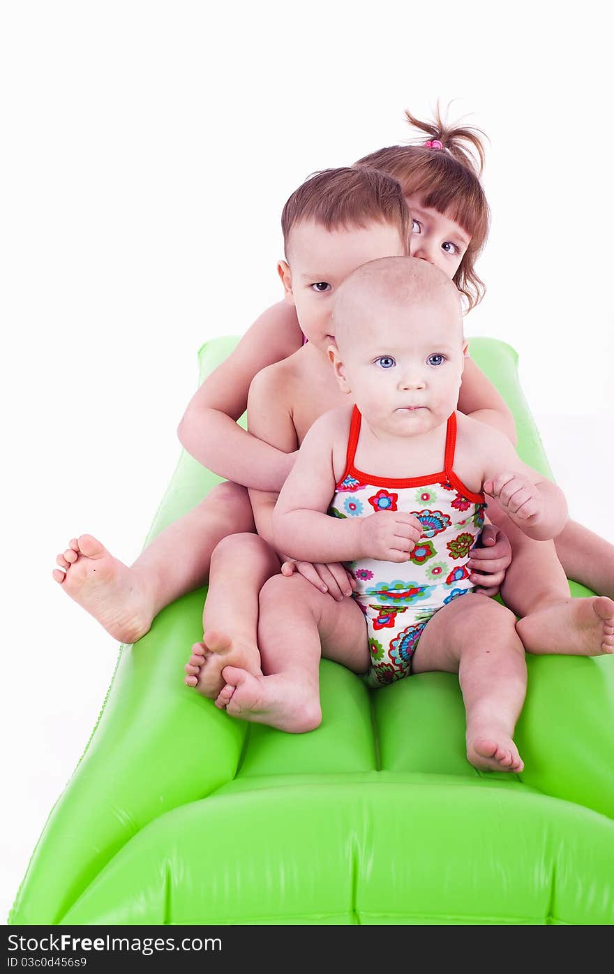 Three Children In Swimsuits