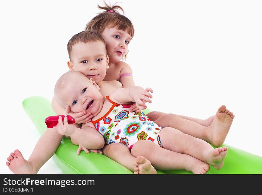 Three children in swimsuits