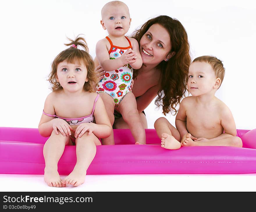 Mother With Three Children In Swimsuits