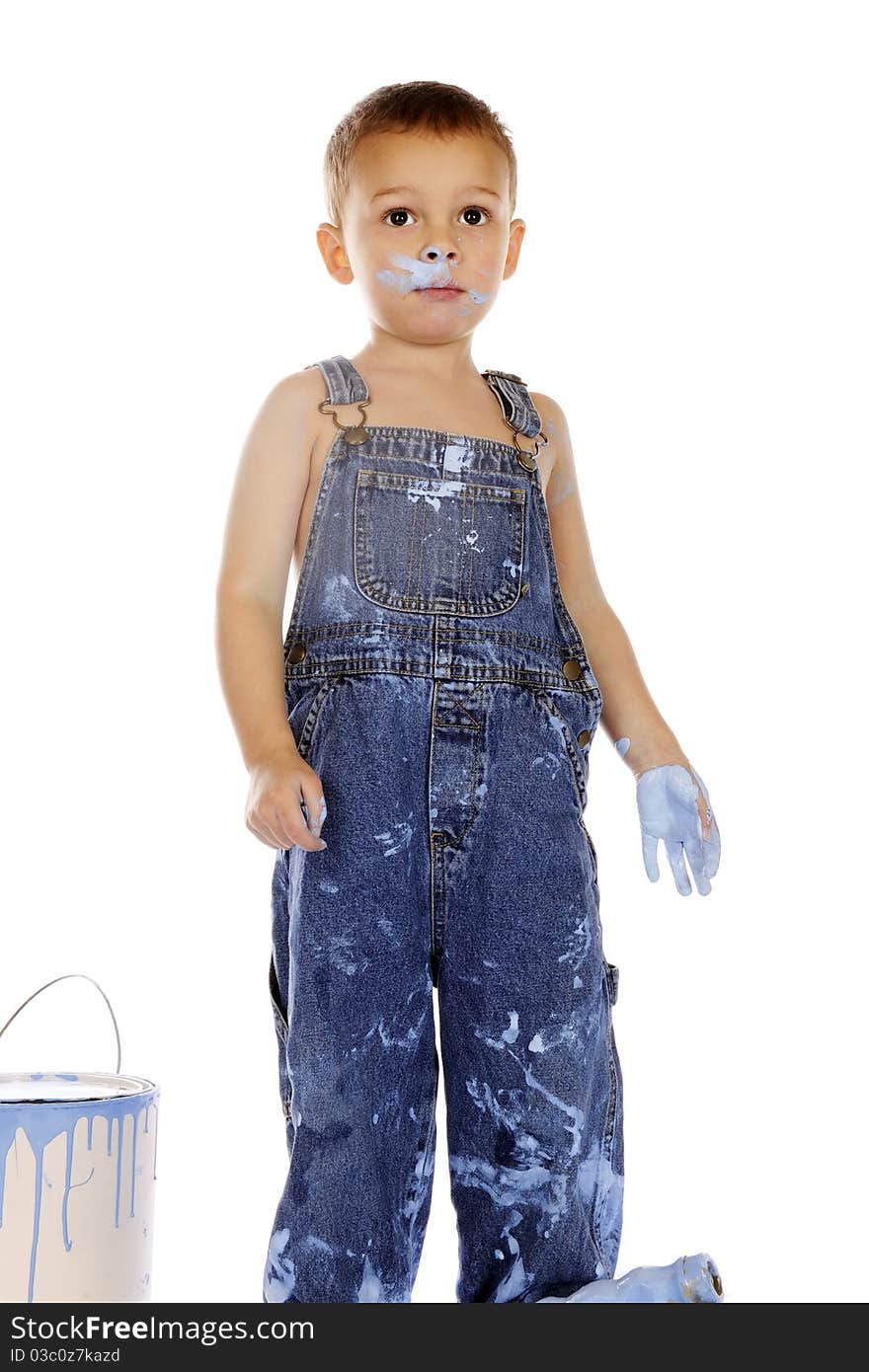 A preschooler innocently covered in blue paint. Isolated on white. A preschooler innocently covered in blue paint. Isolated on white.