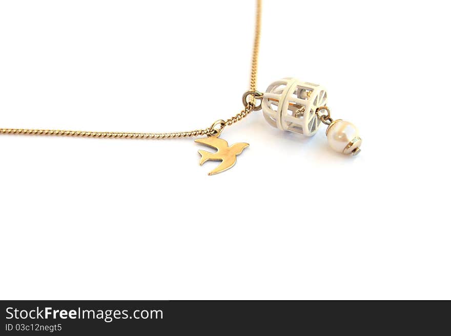 Necklace with bird and cage medallions isolated on white background.