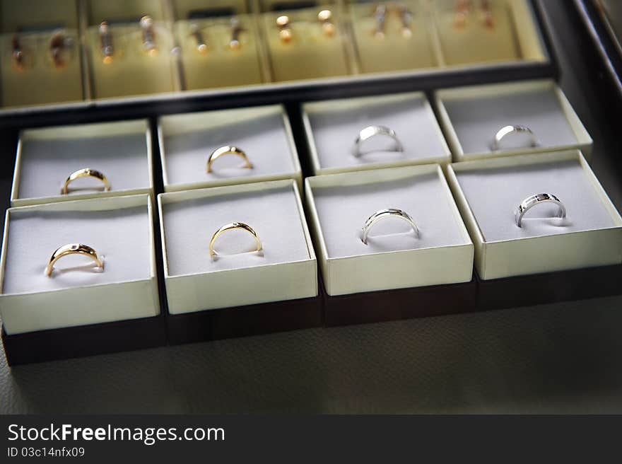 Golden rings in boxes in the store